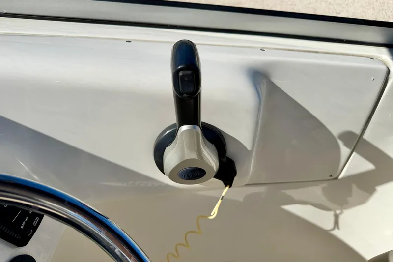Slide: The Image of Throttle control on 2023 Key West 239 DFS boat dashboard. - 18