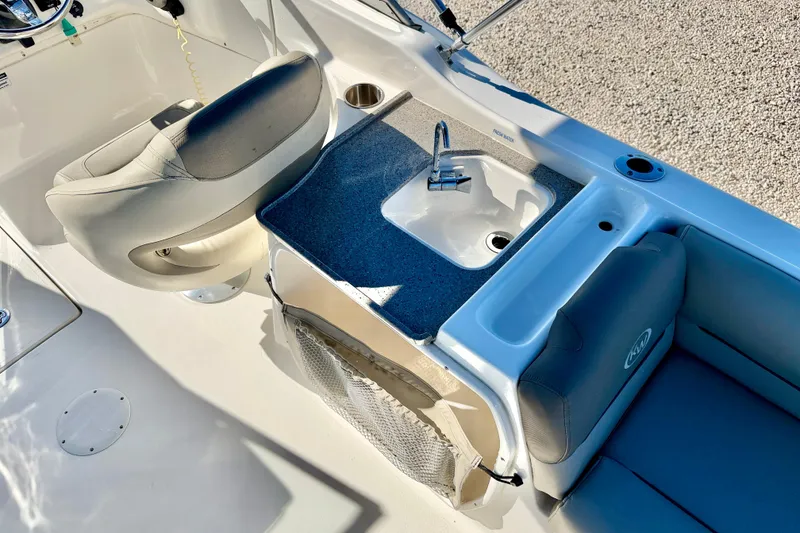 Slide: The Image of 2023 Key West 239 DFS boat interior with sink and seating area. - 24