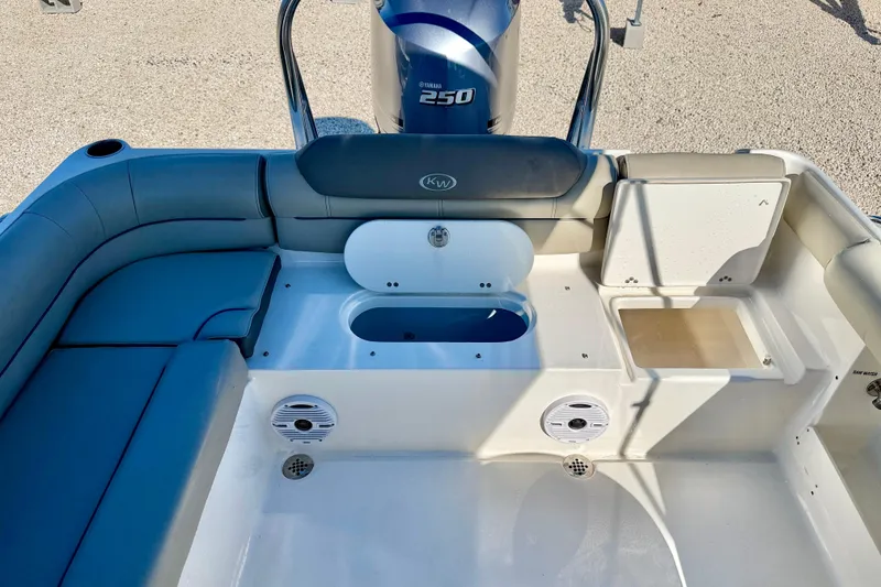 Slide: The Image of 2023 Key West 239 DFS boat interior with seating and storage compartments. - 29