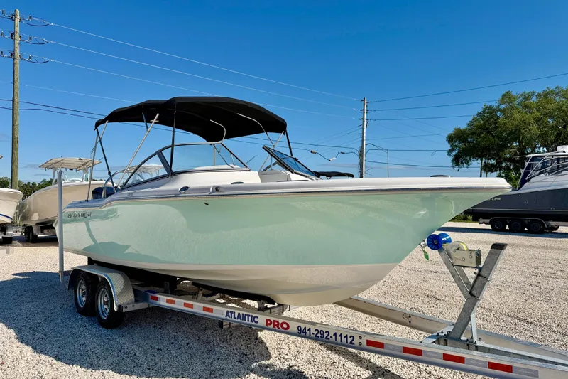 Slide: The Image of 2023 Key West 239 DFS boat on trailer, sunny day, outdoor display. - 3