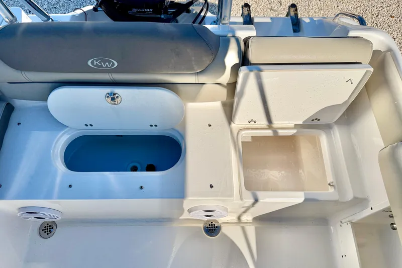Slide: The Image of 2023 Key West 239 DFS boat interior with storage compartments and seating. - 30