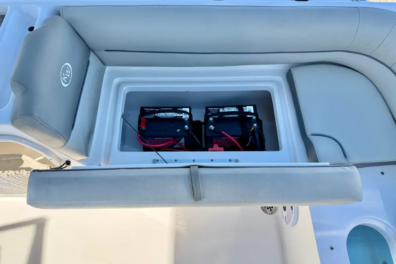 Slide: The Image of 2023 Key West 239 DFS boat battery compartment with seating. - 31