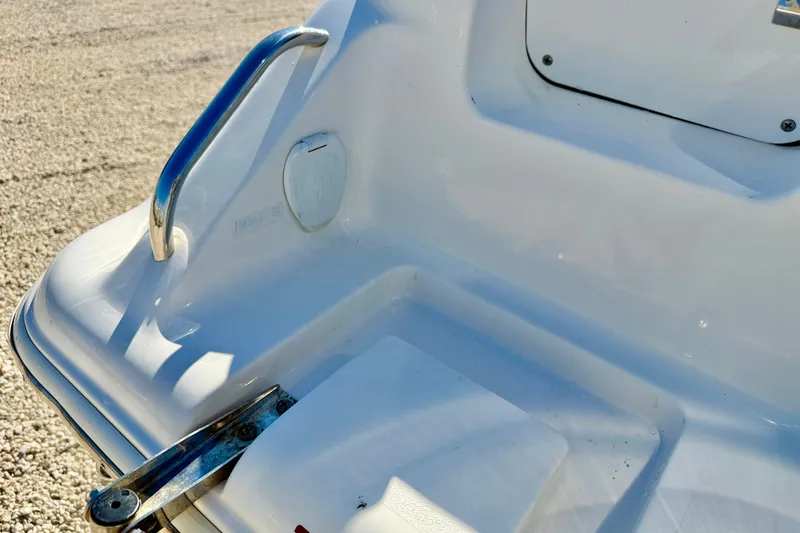 Slide: The Image of Close-up of 2023 Key West 239 DFS boat's rear deck with metal handle. - 32
