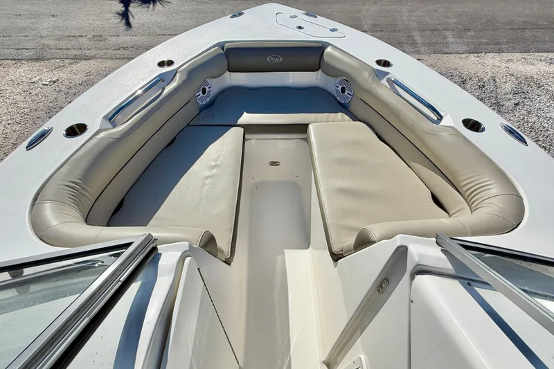 Slide: The Image of 2023 Key West 239 DFS boat interior with beige seating and cup holders. - 9