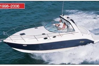 The Image of 2003 Rinker 342 Express Cruiser speeding on open water. - 0