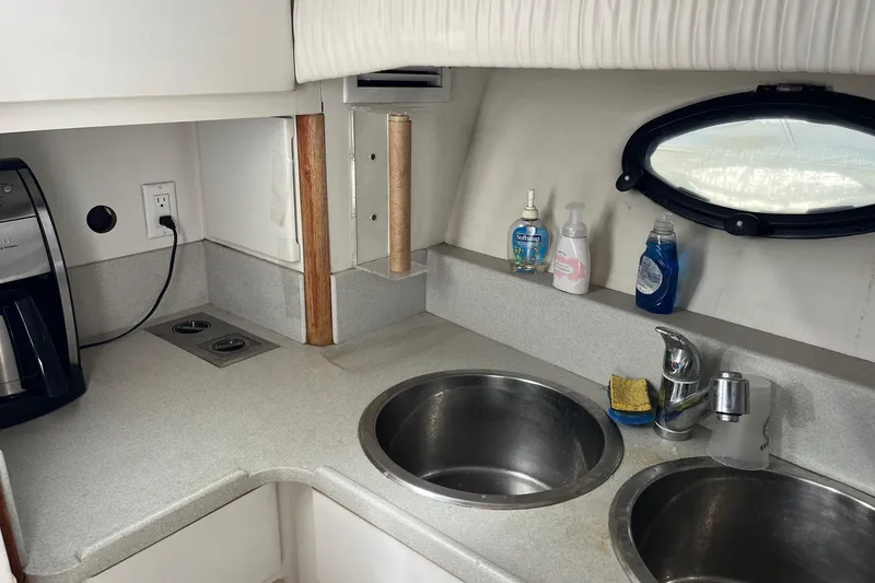 Slide: The Image of Galley kitchen in 1990 Californian 52 Cockpit Motor Yacht with sink and appliances. - 11