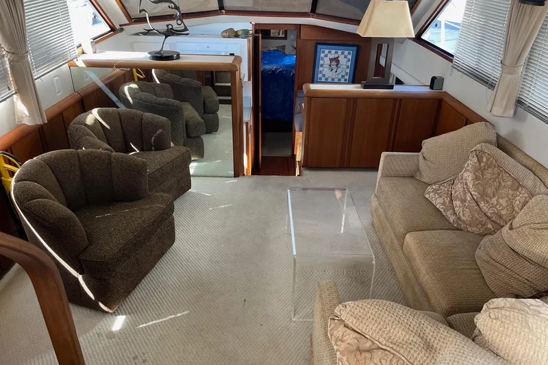 Slide: The Image of Luxurious interior of a 1990 Californian 52 Cockpit Motor Yacht with plush seating and elegant decor. - 2