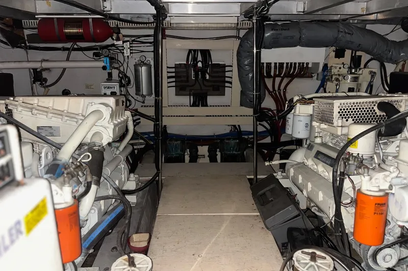 Slide: The Image of Engine room of a 1990 Californian 52 Cockpit Motor Yacht, showcasing machinery and equipment. - 20
