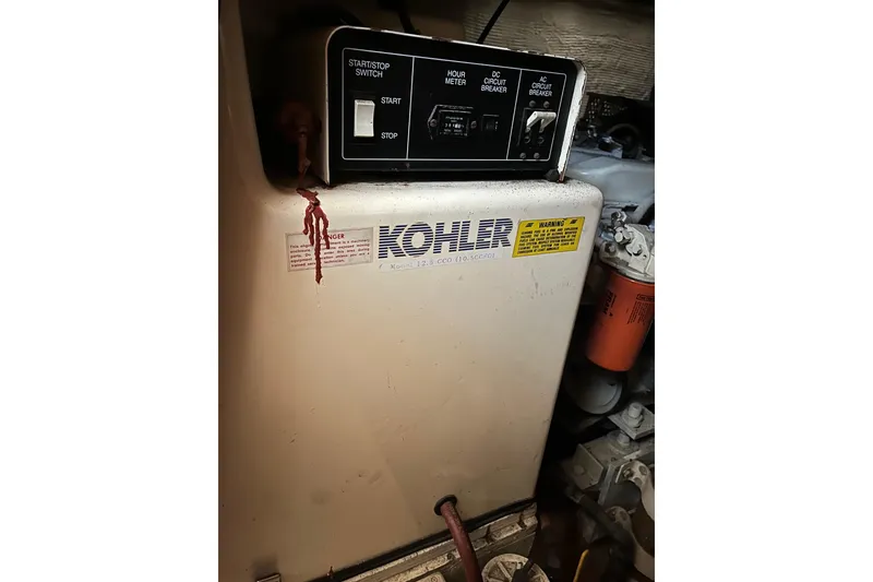 Slide: The Image of Kohler generator control panel on a 1990 Californian 52 Cockpit Motor Yacht. - 22