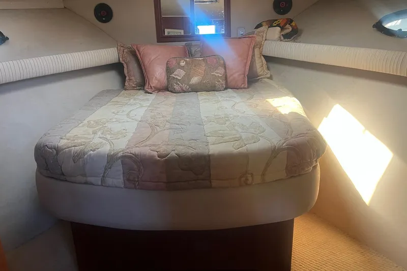Slide: The Image of Cozy bedroom in 1990 Californian 52 Cockpit Motor Yacht with floral bedding and soft lighting. - 5