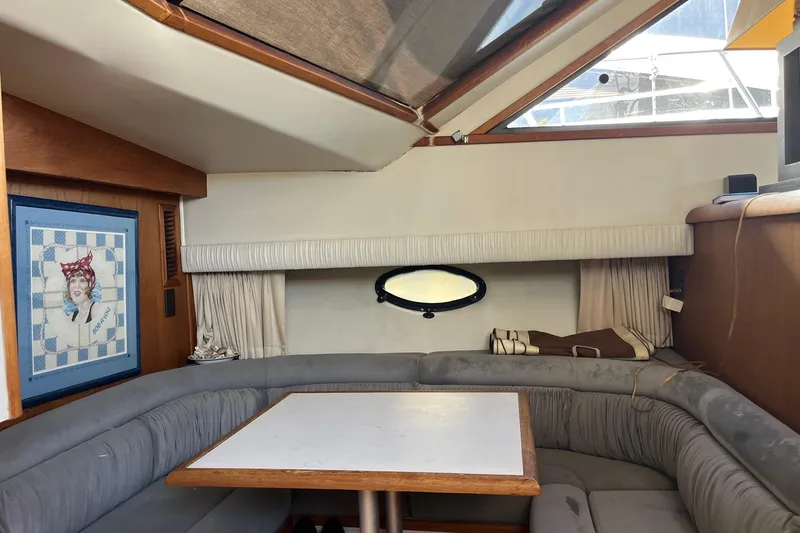 Slide: The Image of Interior of 1990 Californian 52 Cockpit Motor Yacht with cozy seating and nautical decor. - 8