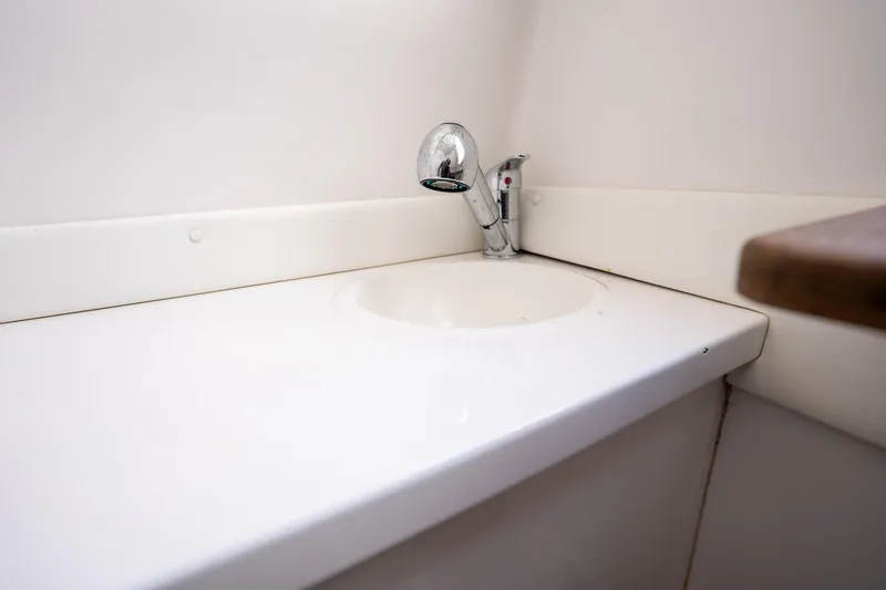 Slide: The Image of White bathroom sink with chrome faucet in 2016 SeaHunter 45 boat. - 11