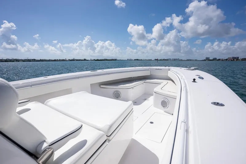 Slide: The Image of 2016 SeaHunter 45 boat deck with seating, cruising on a sunny day. - 14