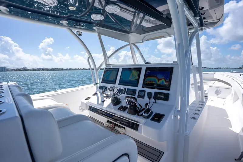 Slide: The Image of Luxurious 2016 SeaHunter 45 boat cockpit with advanced navigation systems, cruising on a sunny day. - 15
