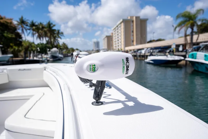 Slide: The Image of 2016 SeaHunter 45 boat with GPS anchor, docked in a sunny marina. - 24