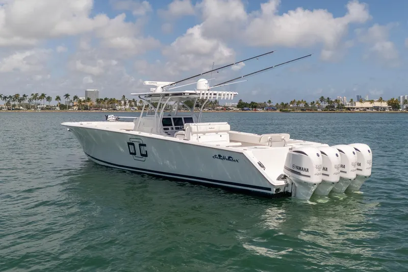 Slide: The Image of 2016 SeaHunter 45 boat with four Yamaha engines on calm water. - 3