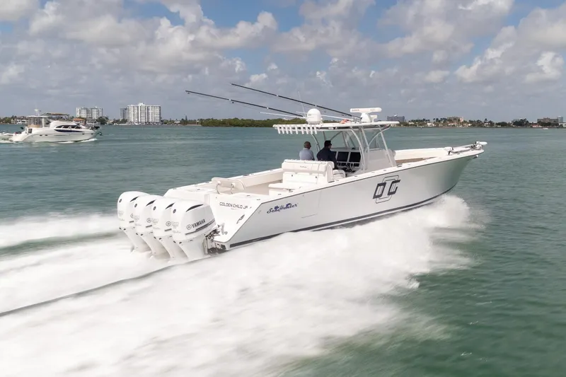 Slide: The Image of 2016 SeaHunter 45 boat cruising on water with multiple outboard engines. - 6