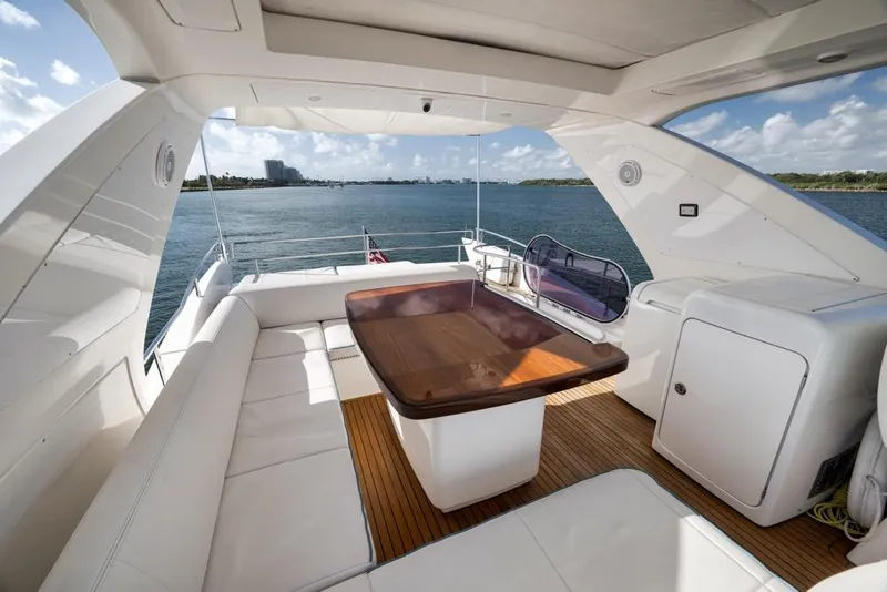 Slide: The Image of Luxurious 2012 Azimut 64 yacht deck with elegant seating and ocean view. - 15