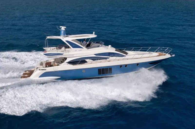Slide: The Image of Luxurious 2012 Azimut 64 yacht cruising on open blue sea. - 2