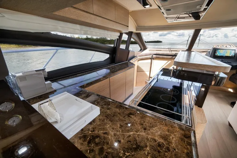 Slide: The Image of Luxurious interior of a 2012 Azimut 64 yacht with modern kitchen and scenic water view. - 20