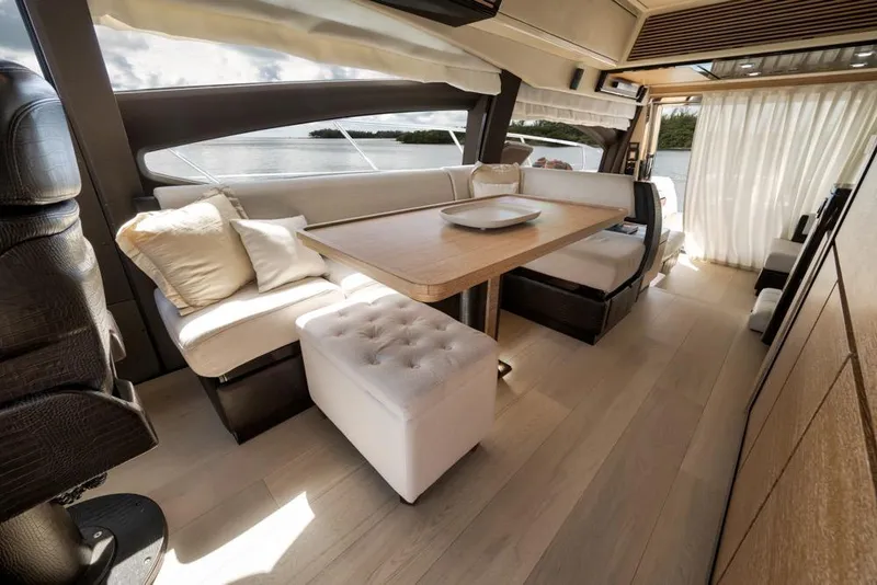 Slide: The Image of Luxurious interior of a 2012 Azimut 64 yacht with elegant seating and dining area. - 22