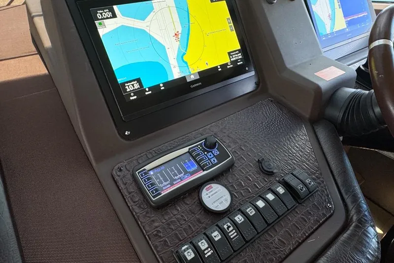 Slide: The Image of Control panel of a 2012 Azimut 64 yacht with navigation display. - 24