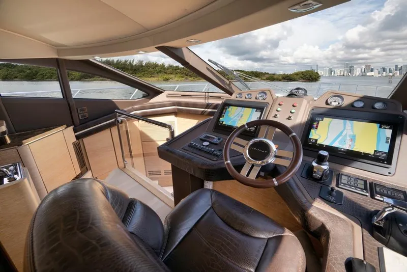 Slide: The Image of Luxurious 2012 Azimut 64 yacht cockpit with navigation screens and leather seating. - 26
