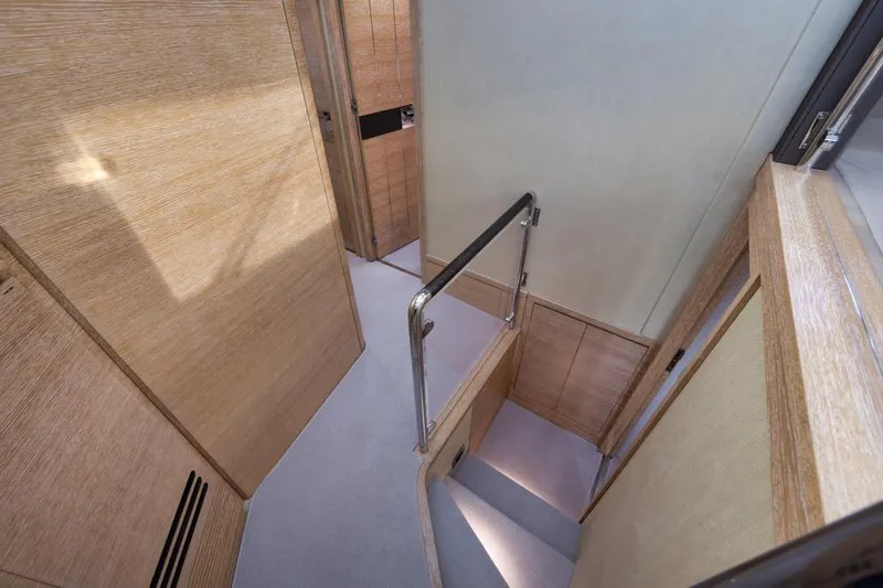 Slide: The Image of Interior staircase of 2012 Azimut 64 yacht with wooden paneling and modern design. - 28