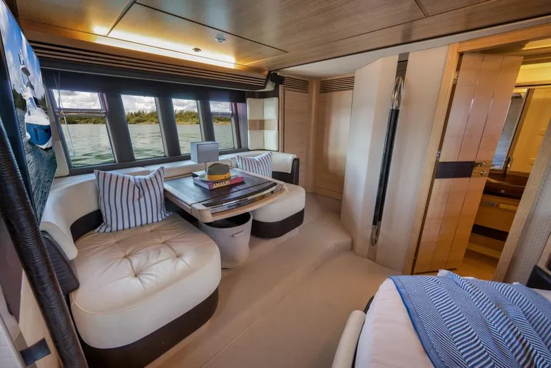 Slide: The Image of Luxurious interior of 2012 Azimut 64 yacht with elegant seating and scenic windows. - 35