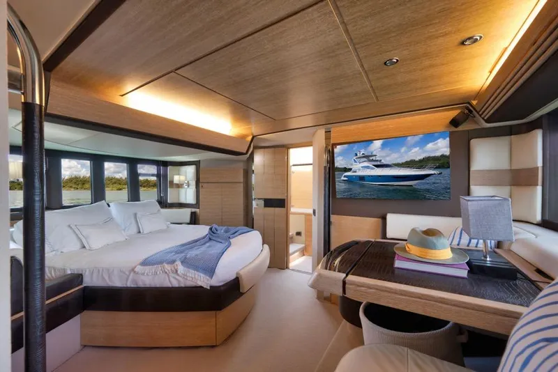 Slide: The Image of Luxurious interior of a 2012 Azimut 64 yacht with elegant bedroom and seating area. - 37