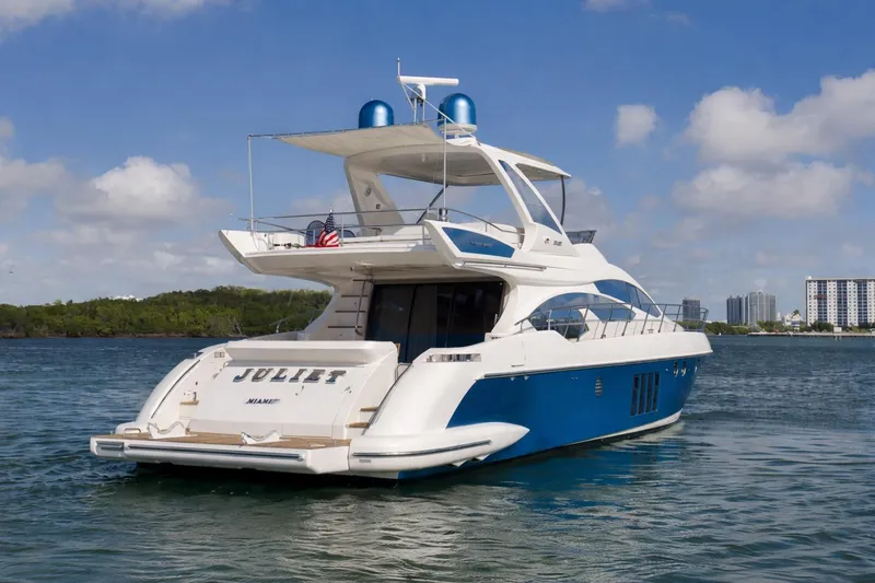 Slide: The Image of Luxury 2012 Azimut 64 yacht on water, clear sky background. - 4