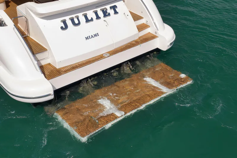 Slide: The Image of Azimut 64 yacht from 2012, named "Juliet," docked in Miami waters. - 5
