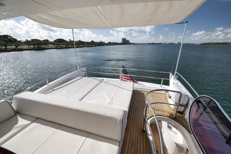 Slide: The Image of Luxurious 2012 Azimut 64 yacht deck with scenic waterfront view. - 9