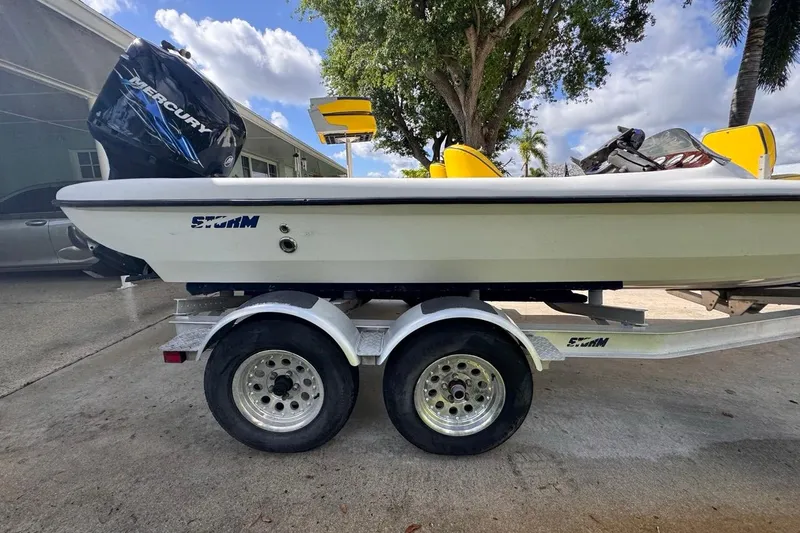 Slide: The Image of 2005 Storm Boats Storm-High Performance on trailer, featuring Mercury outboard motor. - 12