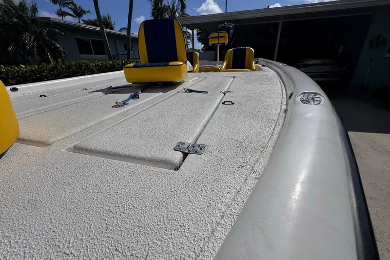 Slide: The Image of 2005 Storm Boats Storm-High Performance deck with yellow seats, outdoor setting. - 28