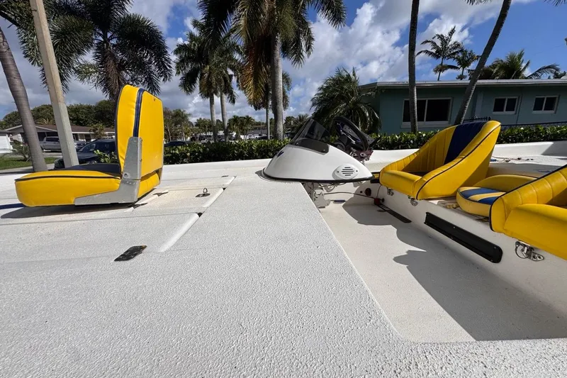 Slide: The Image of 2005 Storm Boats Storm-High Performance with yellow seats, palm trees in background. - 31