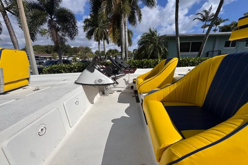 Slide: The Image of 2005 Storm Boats Storm-High Performance with yellow seats, palm trees in background. - 32