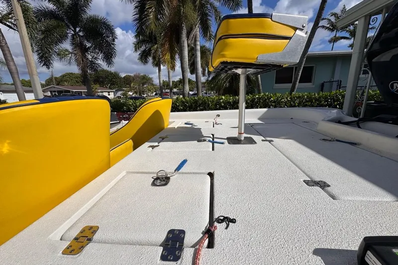 Slide: The Image of 2005 Storm Boats Storm-High Performance deck with yellow seating, palm trees in background. - 33