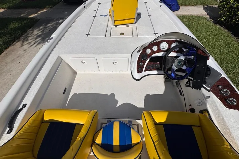 Slide: The Image of 2005 Storm Boats Storm-High Performance interior with yellow seats and modern dashboard. - 40