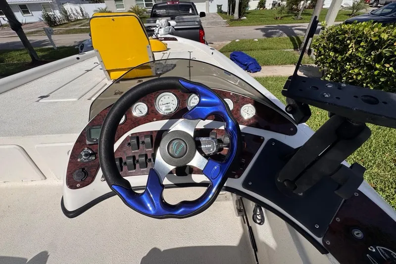 Slide: The Image of 2005 Storm Boats Storm-High Performance dashboard with blue steering wheel and gauges. - 41