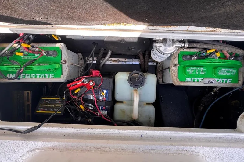 Slide: The Image of Battery compartment of a 2005 Storm Boats Storm-High Performance, featuring Interstate batteries. - 46
