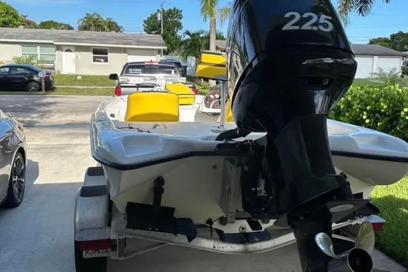 Slide: The Image of 2005 Storm Boats Storm-High Performance on trailer, featuring yellow seats and Mercury engine. - 5