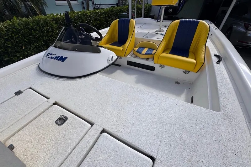 Slide: The Image of 2005 Storm Boats Storm-High Performance with yellow seats and sleek design. - 52
