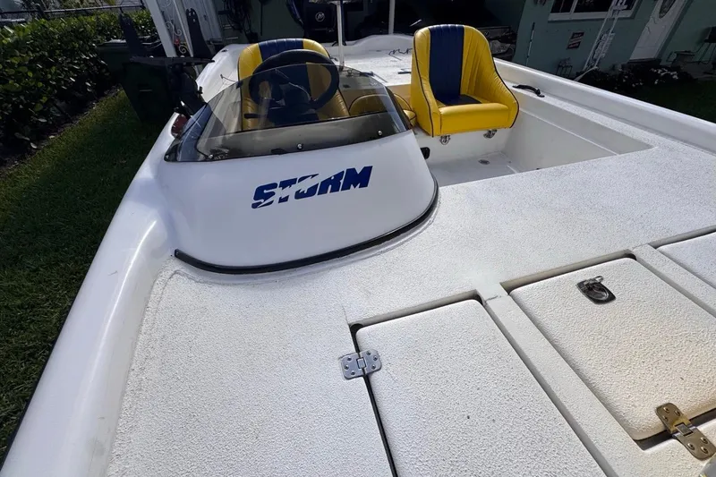 Slide: The Image of 2005 Storm Boats Storm-High Performance boat with yellow seats and white deck. - 53