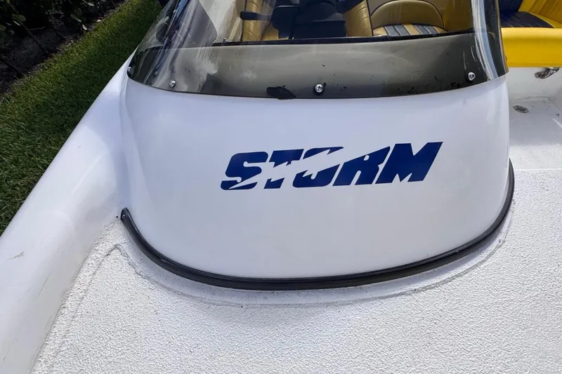 Slide: The Image of 2005 Storm Boats Storm-High Performance boat with logo on white surface. - 54