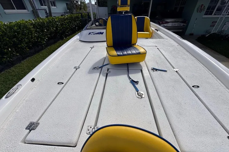 Slide: The Image of 2005 Storm Boats Storm-High Performance with yellow and blue seating on deck. - 55