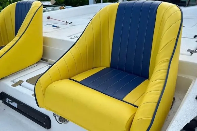 Slide: The Image of 2005 Storm Boats Storm-High Performance on trailer, featuring yellow seats and Mercury outboard motor. - 6