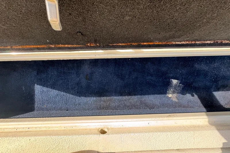 Slide: The Image of 2005 Storm Boats Storm-High Performance interior with worn carpet detail. - 60