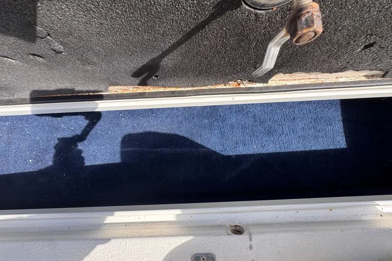 Slide: The Image of Interior view of a 2005 Storm Boats Storm-High Performance, showing a blue carpeted compartment. - 63