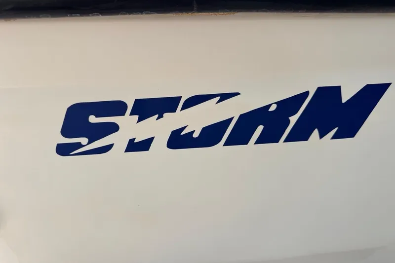 Slide: The Image of Storm Boats logo on 2005 Storm-High Performance model, featuring bold blue lettering. - 66